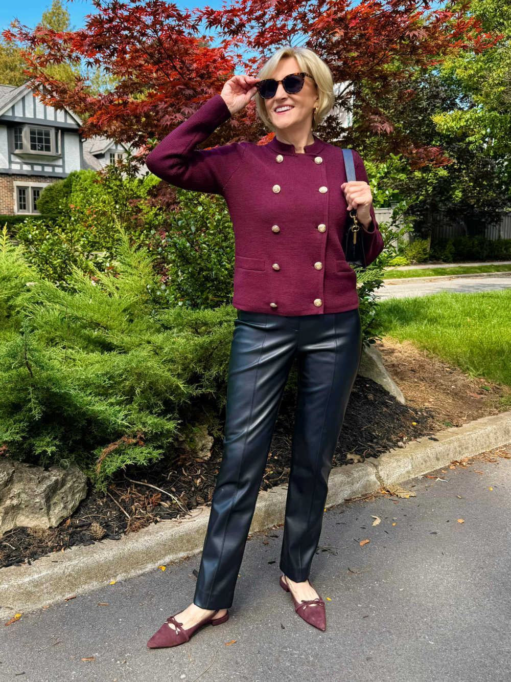 burgundy sweater jacket and leather pants