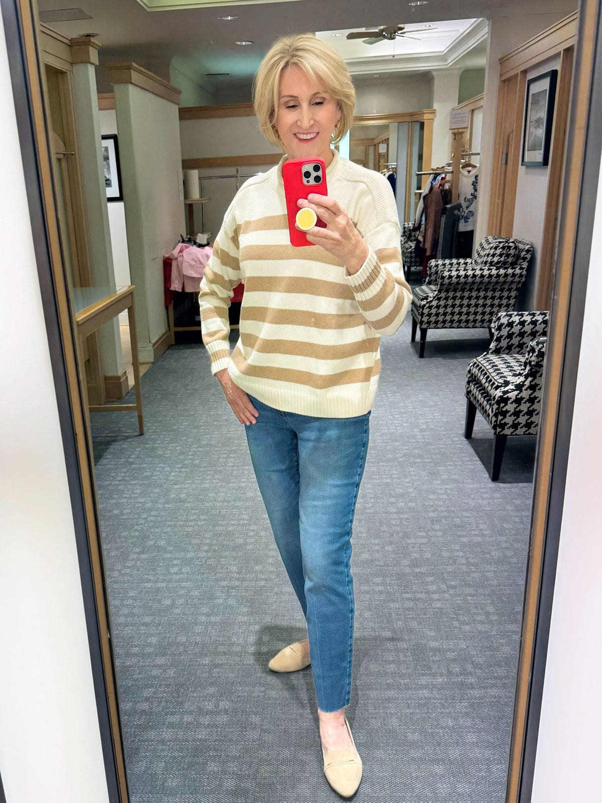 tan and cream roll neck sweater with jeans