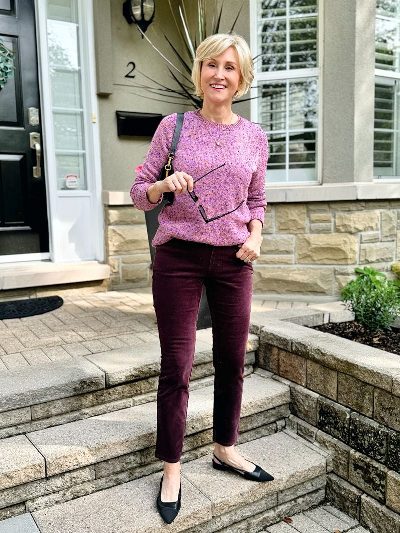 purple pinwale corduroy pants with purple textured sweater modeled by Deborah Boland from Fabulous After 40