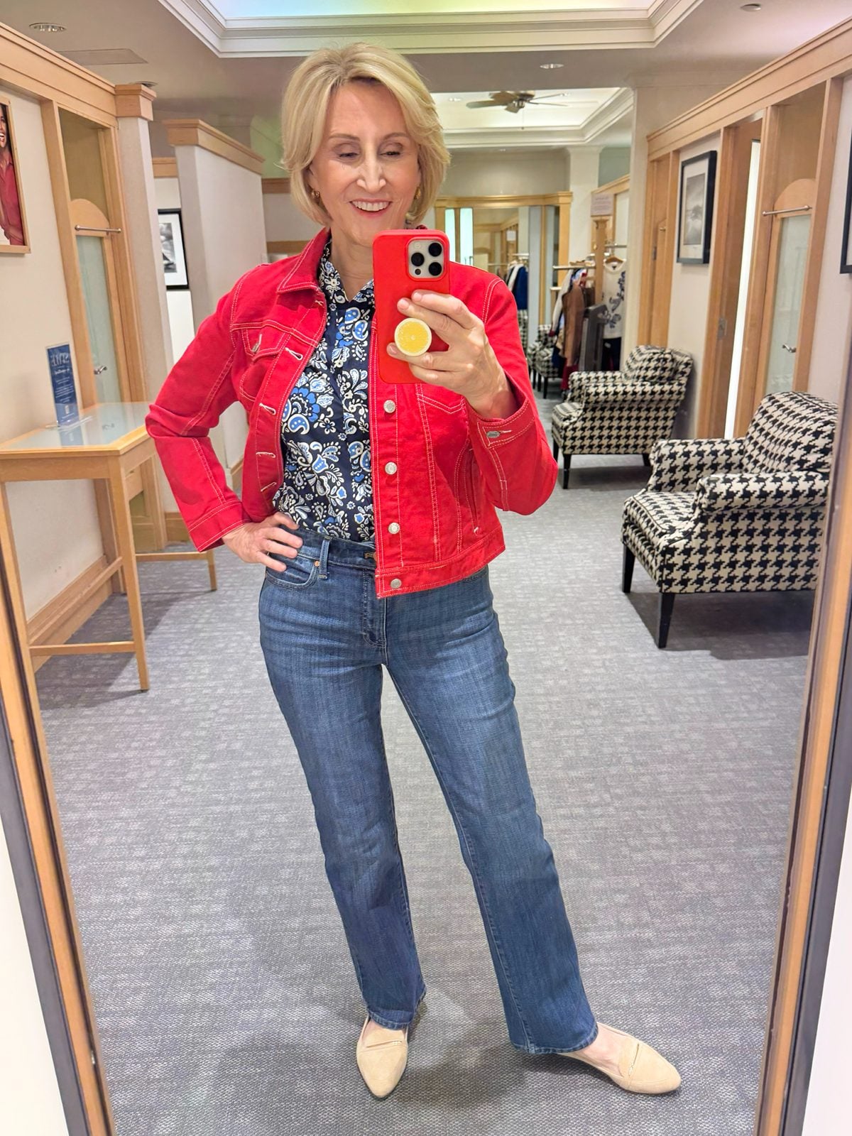 red denim jacket outfit with print shirt and jeans